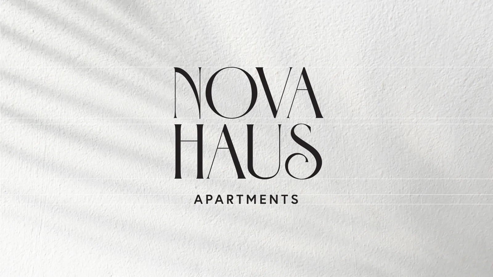 Nova Haus Apartments logo on textured white paper